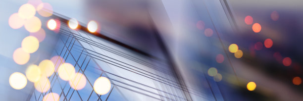 摘要商业现代城市城市未来建筑背景。房地产概念，动态模糊，高层摩天楼立面的玻璃反射，色调蓝色的画面与散景图片下载