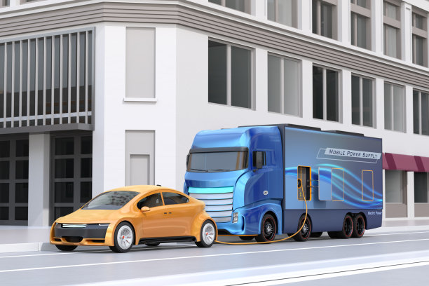 电动汽车在路边从供电卡车充电图片下载