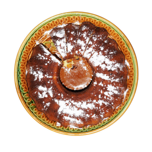 大的圆纸杯蛋糕，盘子上有糖粉图片下载