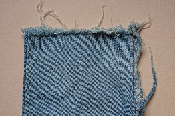 蓝色的棉质裤腿，有白色的线图片下载