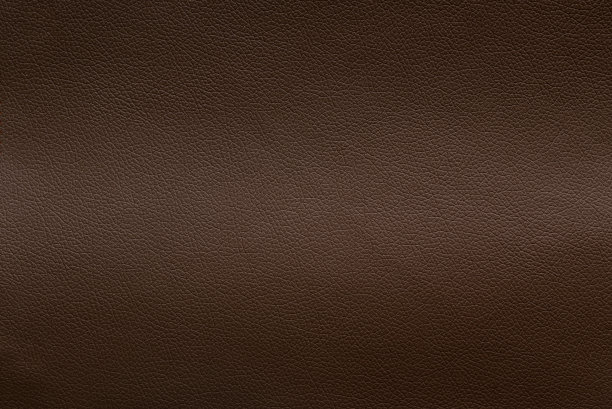 棕色皮革纹理，有轻微的弹性，背景。图片下载