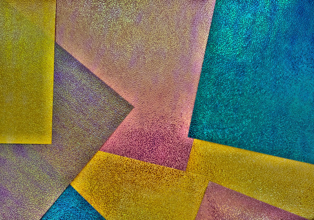 色彩丰富的灰熊几何风格的背景。纹理压花纸有光泽，闪着光晕效果。本空间图片下载