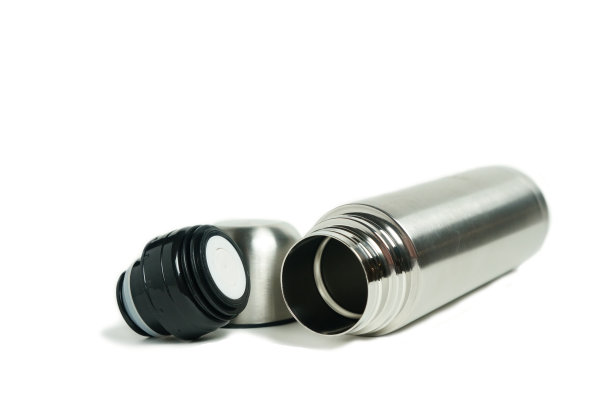 开着瓶盖的金属热水瓶图片下载