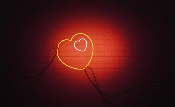 心形红色霓虹灯对坐在黑墙上-母亲节的概念图片下载