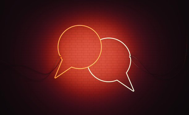 在线消息概念-白色和红色霓虹灯语音气泡一对坐在黑墙图片下载