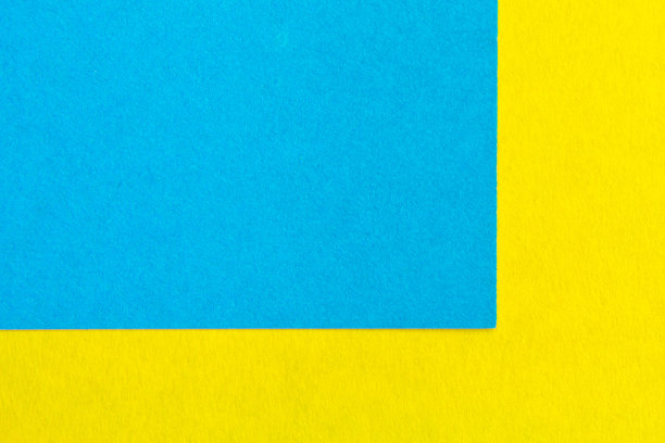 黄色和蓝色的纸纹理背景颜色。趋势颜色，几何背景的纸张。彩色软纸背景。柔和的颜色。图片下载