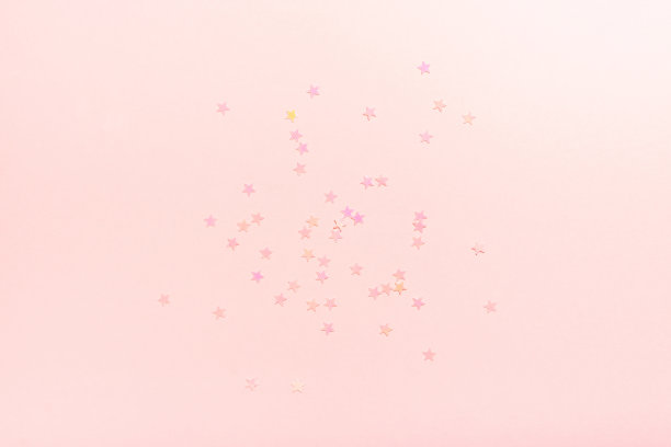 精致的粉红色背景与星星。图片下载