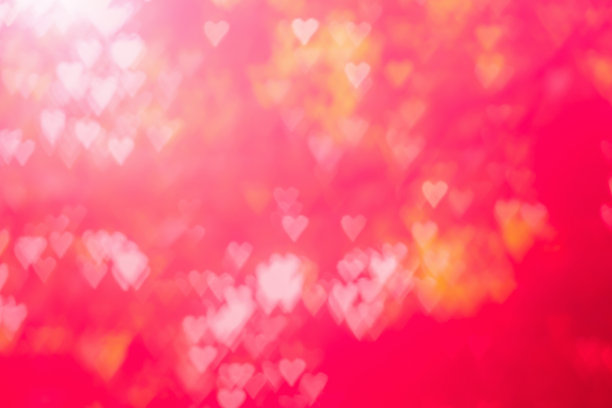 红色热辣，激情四射，魅力四射，背景明艳散景。心形的虚景红色抽象背景横幅。爱情主题说明。情人节的概念。副本的空间。装饰亮片设计。图片下载