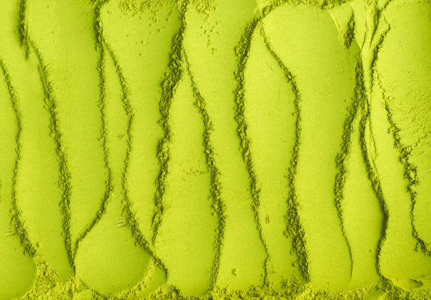 抹茶粉的背景。绿茶质地特写，选择性聚焦图片下载