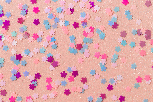 小樱花在闪闪发光的纸上，粉红色的花闪闪发光，春天的背景图片下载