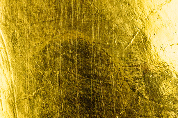 用金色颜料画的一张纸。背景或纹理图片下载