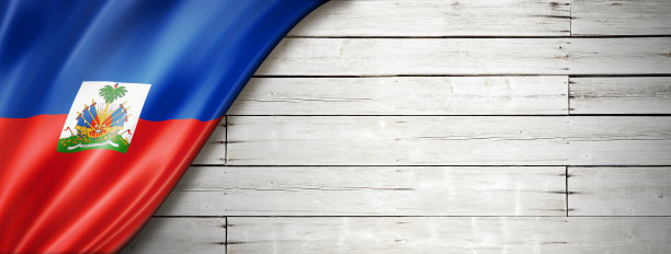 海地国旗上挂着古老的白墙条幅图片下载