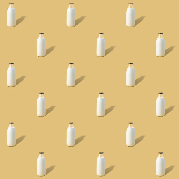 创意无缝模式与一瓶素食牛奶在黄色的背景图片下载