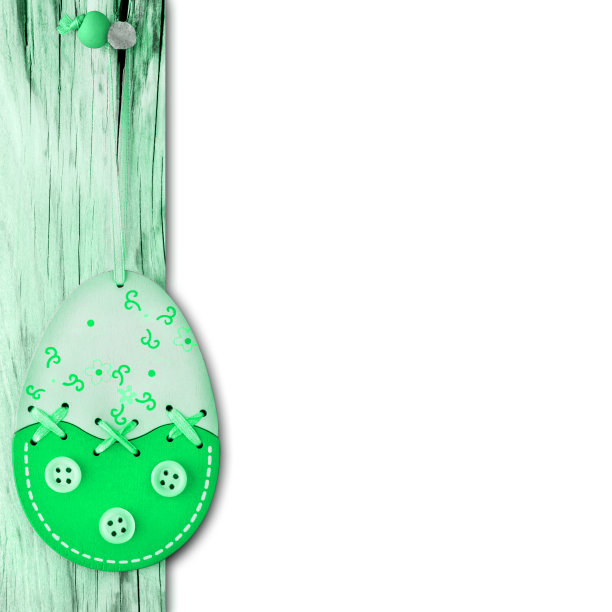 木制的绿色复活节装饰蛋和白色的背景图片下载