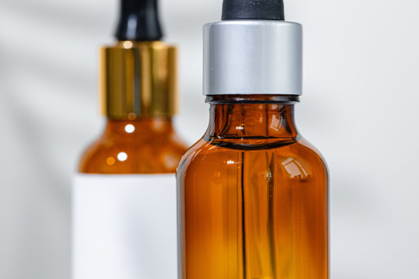 近距离照片的玻璃化妆品容器的油性纹理图片下载