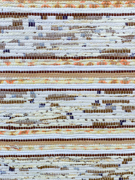 特写破地毯。织物中重用。棕色，黄色，白色，蓝色和橙色。图片下载
