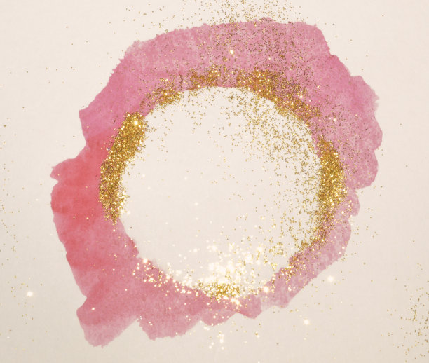 抽象的粉色水彩飞溅和金色闪着复古的怀旧色彩图片下载