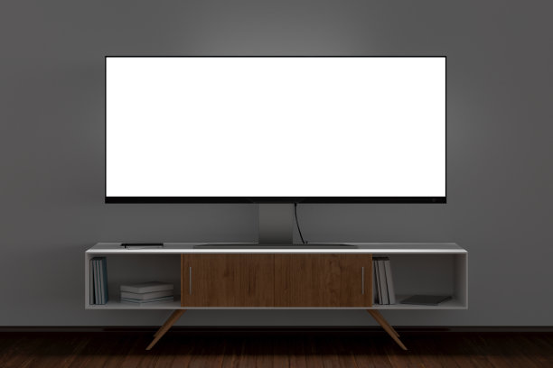 白色墙壁的客厅的电视架上，在晚上发光的电视宽屏。图片下载