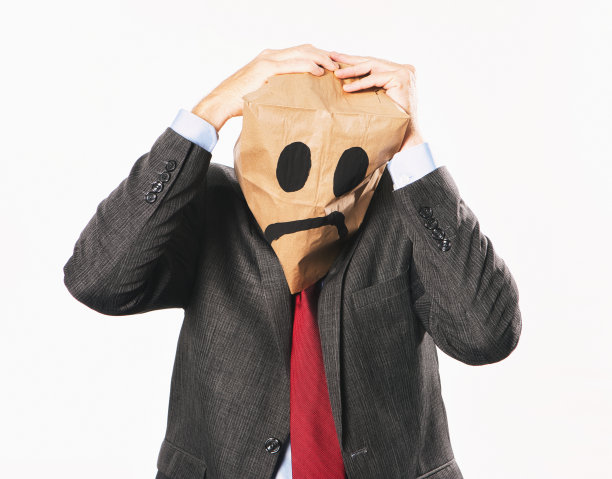 西装商人穿着卡通纸袋绝望地抓着头图片下载