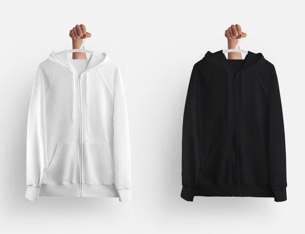 白色，黑色帽衫的拉链关闭，口袋挂在衣架在手，空白的长袖衣服孤立的背景。图片下载