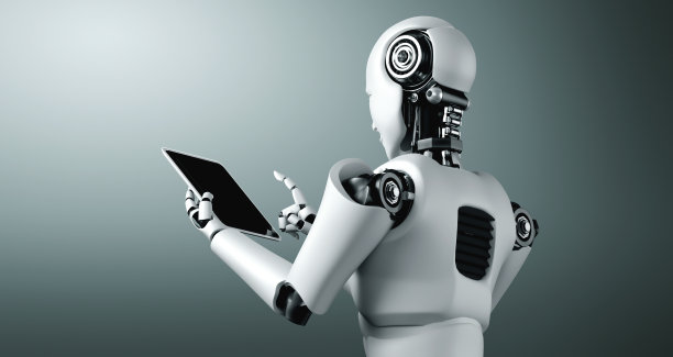 仿人机器人在未来的办公室使用平板电脑图片下载