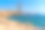 安达卢西亚尼贾尔加塔Cabo de Gata的自然公园里，一个年轻人坐在岩石上观看Playa los Escullos湖。西班牙、地中海图片下载