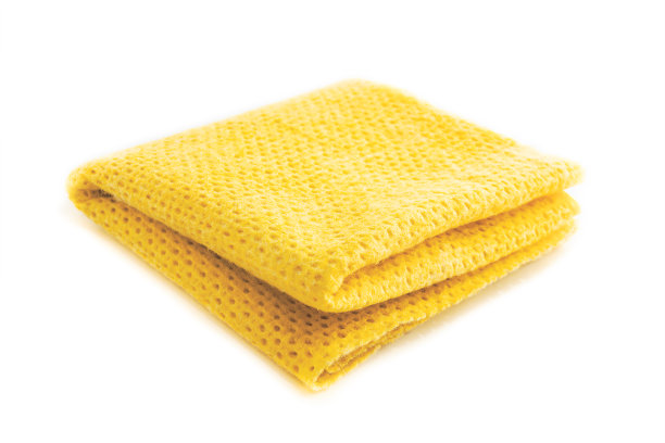 黄色厨房纤维素餐巾特写。图片下载