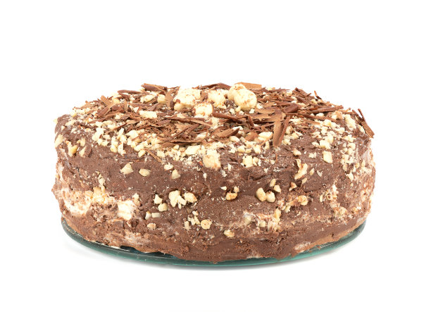 撒有巧克力片和榛子的奶油蛋糕。图片下载