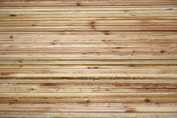 堆叠木板或木板的自然背景正面视图。图片下载