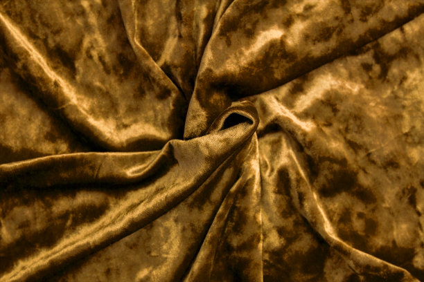 面料是金黄色的天鹅绒。这种丝绒织物的质地是金黄色的。图片下载