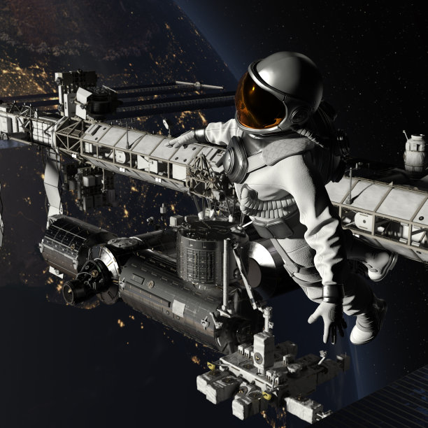 宇航员在太空中靠近以地球为背景的空间站行走图片下载