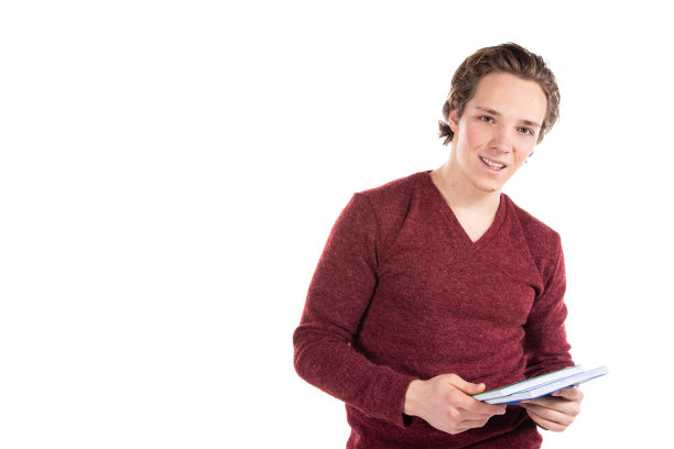 白色背景下的学生。年轻有魅力的男人和书。图片下载
