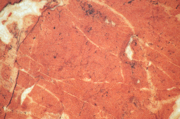 浅红色的缟玛瑙与白色的纹理，一个平坦的抛光天然石材表面的特写。图片下载