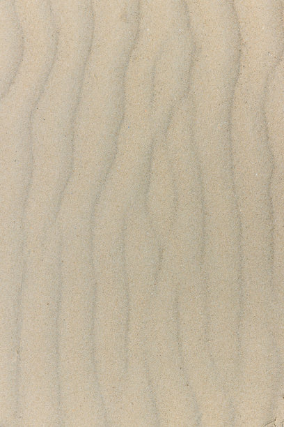 天然砂石纹理背景。以沙滩上的沙子为背景。波浪沙背景夏季设计。图片下载