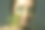 年轻女子肖像与自然化妆模糊与散焦黄杨木枝。绿叶贴在脸上。草药的概念。图片下载