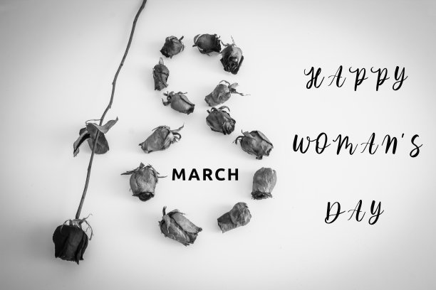 3月8日是国际妇女节。白色背景上的妇女节图片。黑白玫瑰照片。图片下载