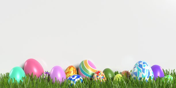 装饰复活节彩蛋在草地上白色的背景与花的装饰图片下载