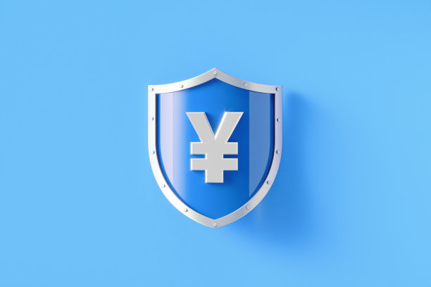 银盾与日元标志坐在蓝色的背景图片下载
