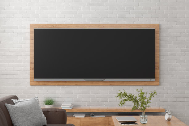 白砖墙上的电视宽屏。图片下载