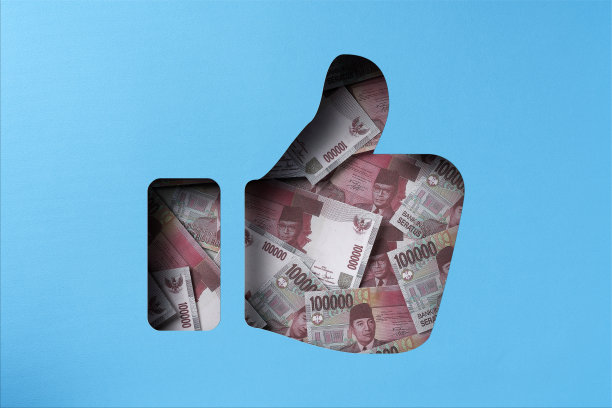 印尼盾堆在纸下剪出大拇指向上的图标图片下载