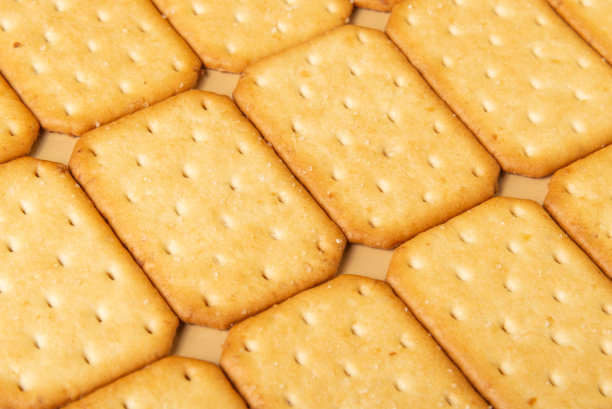 黄色的甜饼干或饼干背景。图片下载