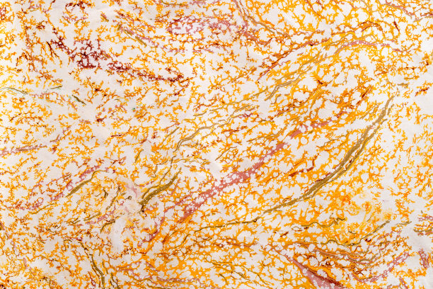 回收工艺粗糙手工橙色和金色纸纹理抽象背景。艺术环保牛皮纸手工制作的粉色蜡染纸天然材料，用于圣诞节、新年、情人节的装饰。图片下载