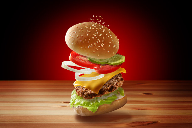 跳汉堡广告，一个豪华新鲜美味的奶酪牛肉汉堡在一个木制的桌子上图片下载