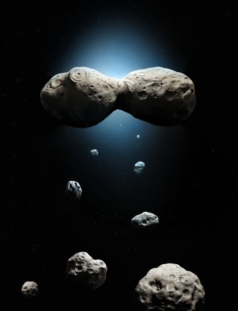 太空中有恒星的小行星带。大型小行星表面的陨石坑。图片下载