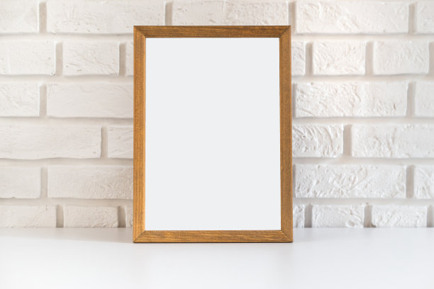 白色砖墙的空白木质画框，具有复制空间图片下载