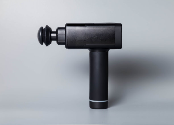 手持无线专业治疗电击按摩枪灰色背景图片下载