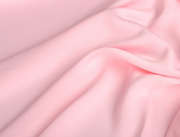 波浪形的淡粉色丝织物。抽象背景雪纺织物的化妆品，霜图片下载