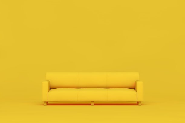 黄色背景上的黄色沙发图片下载