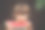2岁的小男孩抱着一块带种子的成熟红西瓜，咬在天然的木棕色背景上，选择性聚焦，复制空间图片下载
