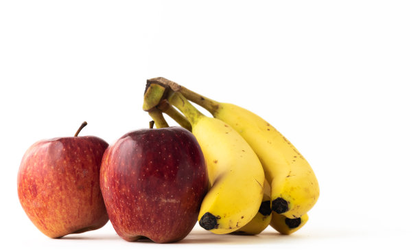 白色背景下的香蕉和苹果图片下载